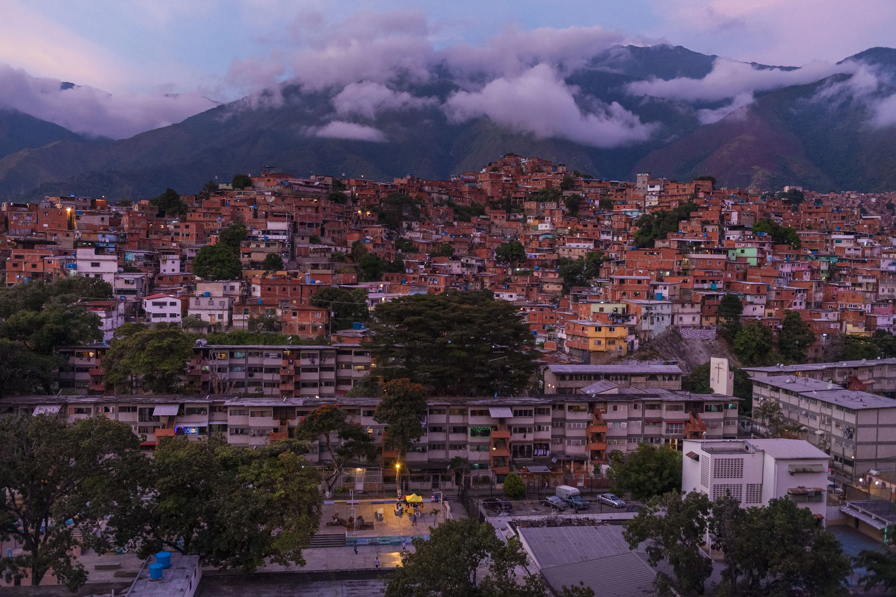 Buildings are seen at dusk in the Petare neighborhood of Caracas, Venezuela.