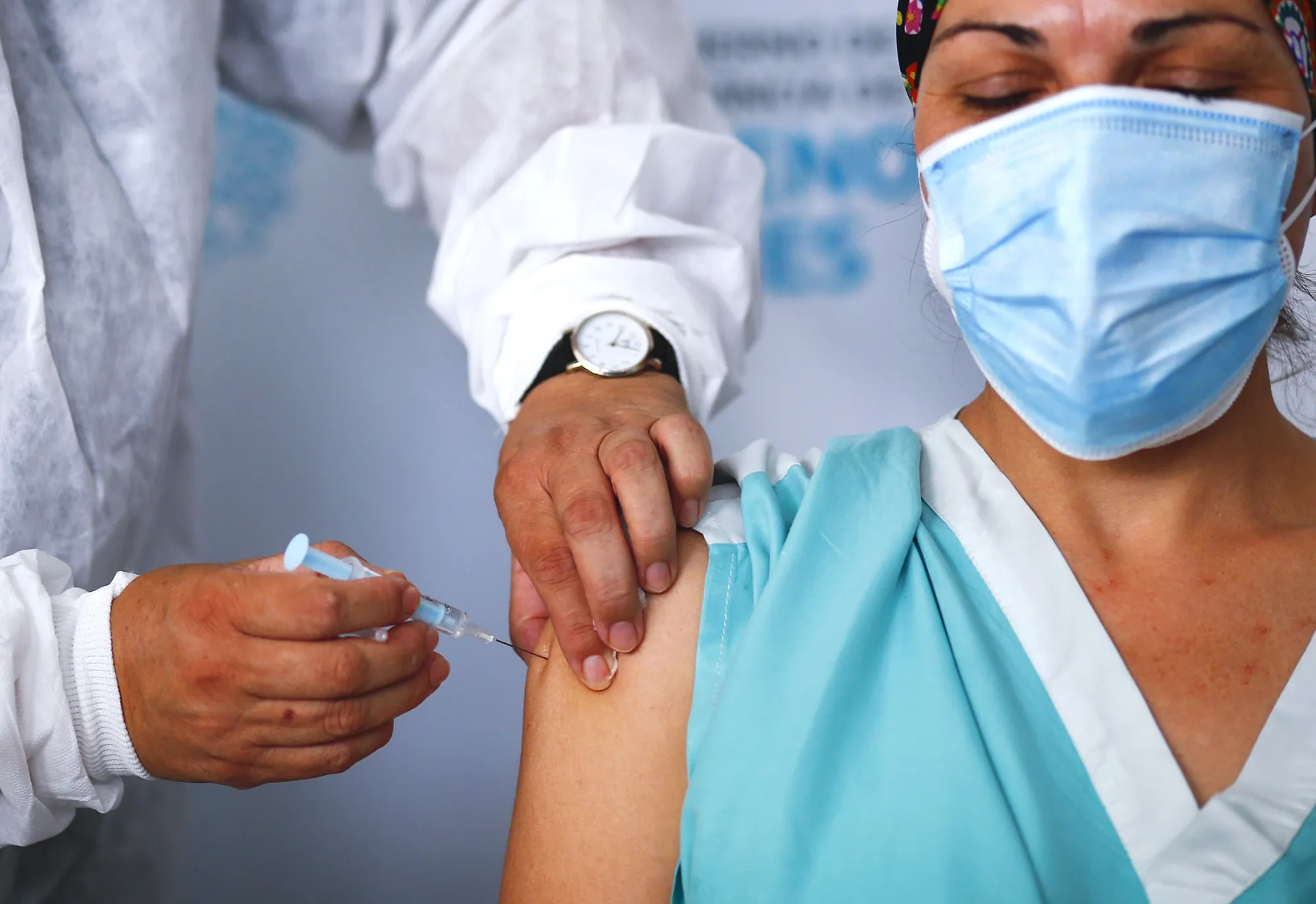 A nurse receives the first dose of ‘Gam-COVID-Vac‘ also known as Sputnik V vaccine in Argentina on Dec. 29, 2020.