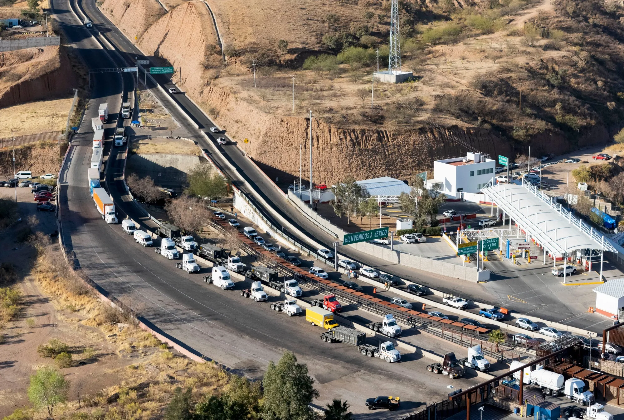 Tractor trailers enter the US from Mexico at the Nogales-Mariposa port of entry.