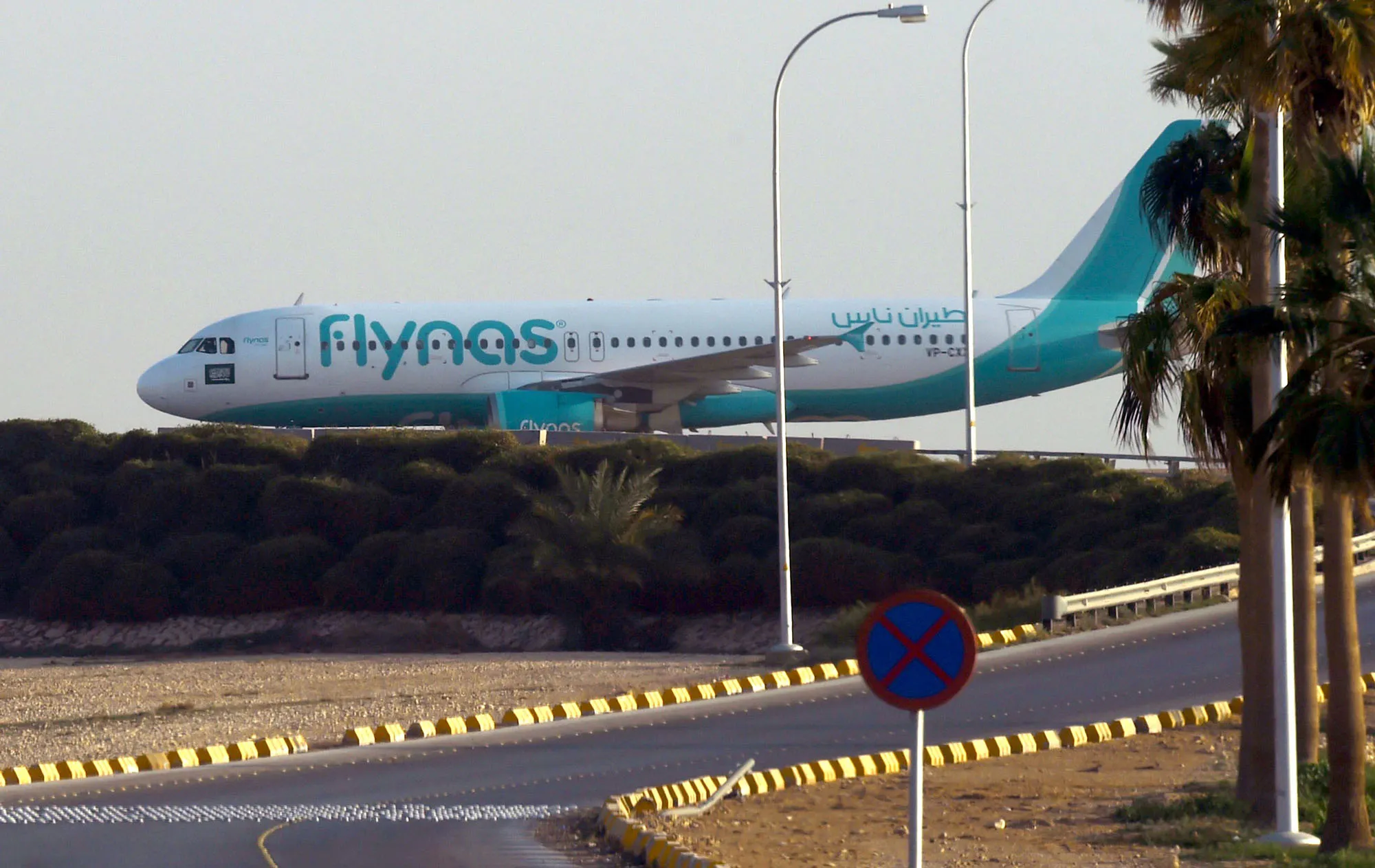 A plane from the low-cost Saudi carrier flynas taxies on the tarmac at the King Khalid International Airport in Riyadh.