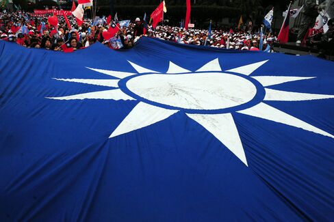 A large Taiwanese flag is seen at a camp