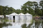 Flood water surrounds grain silos following Tropical Storm Imelda in Fannett, Texas.