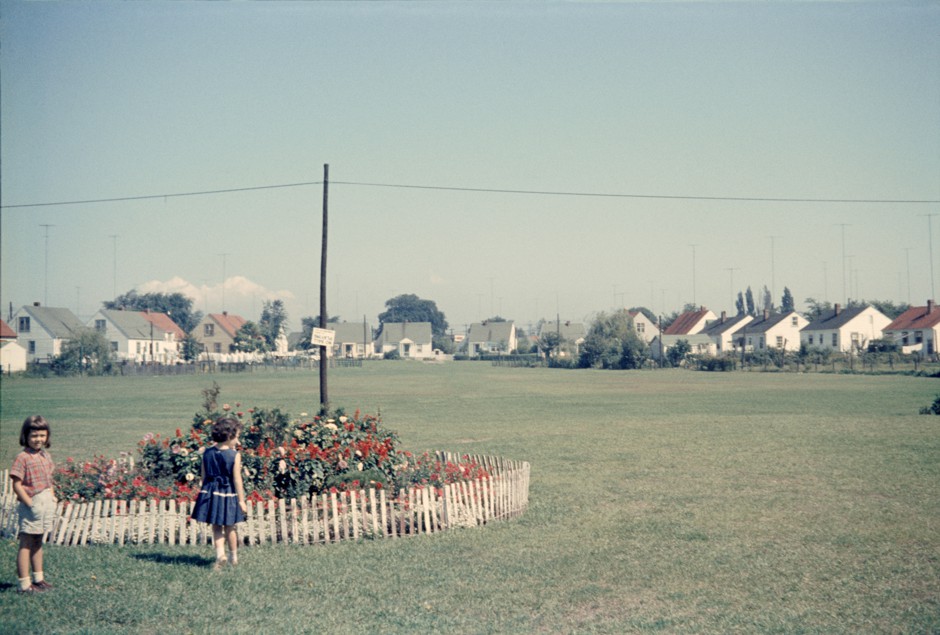 Two girls in Etobicoke's Queensway Park looking north to Uno Drive in 1959. The homes in the background were built in the 1940s for returning war veterans.