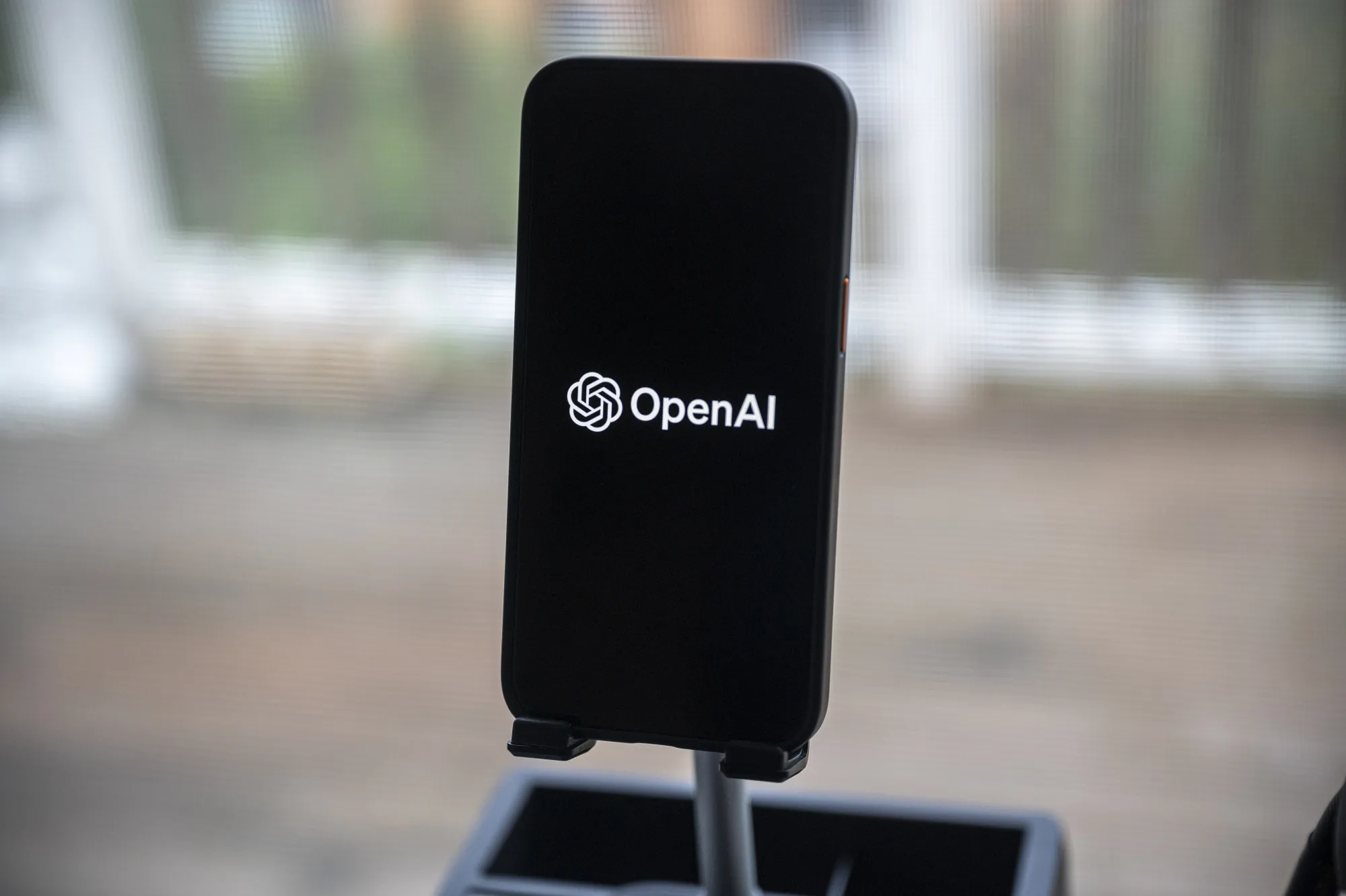 The OpenAI logo on a smartphone.