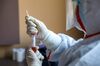 A CDC worker collects biomaterial from suspected 2019-nCoV patients for nucleic acid tests in Wuhan.