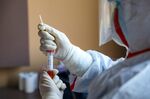 A CDC worker collects biomaterial from suspected 2019-nCoV patients for nucleic acid tests in Wuhan.