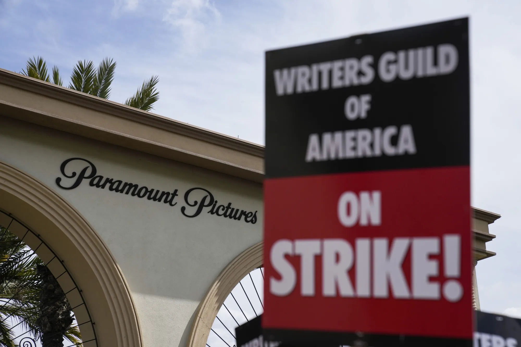 Members of the The Writers Guild of America picket outside Paramount Pictures on May 3, 2023, in Los Angeles. Hollywood productions and promotional tours around the world have been put on indefinite hold as actors and writers are on strike against big studios and streaming services.(AP Photo/Ashley Landis)