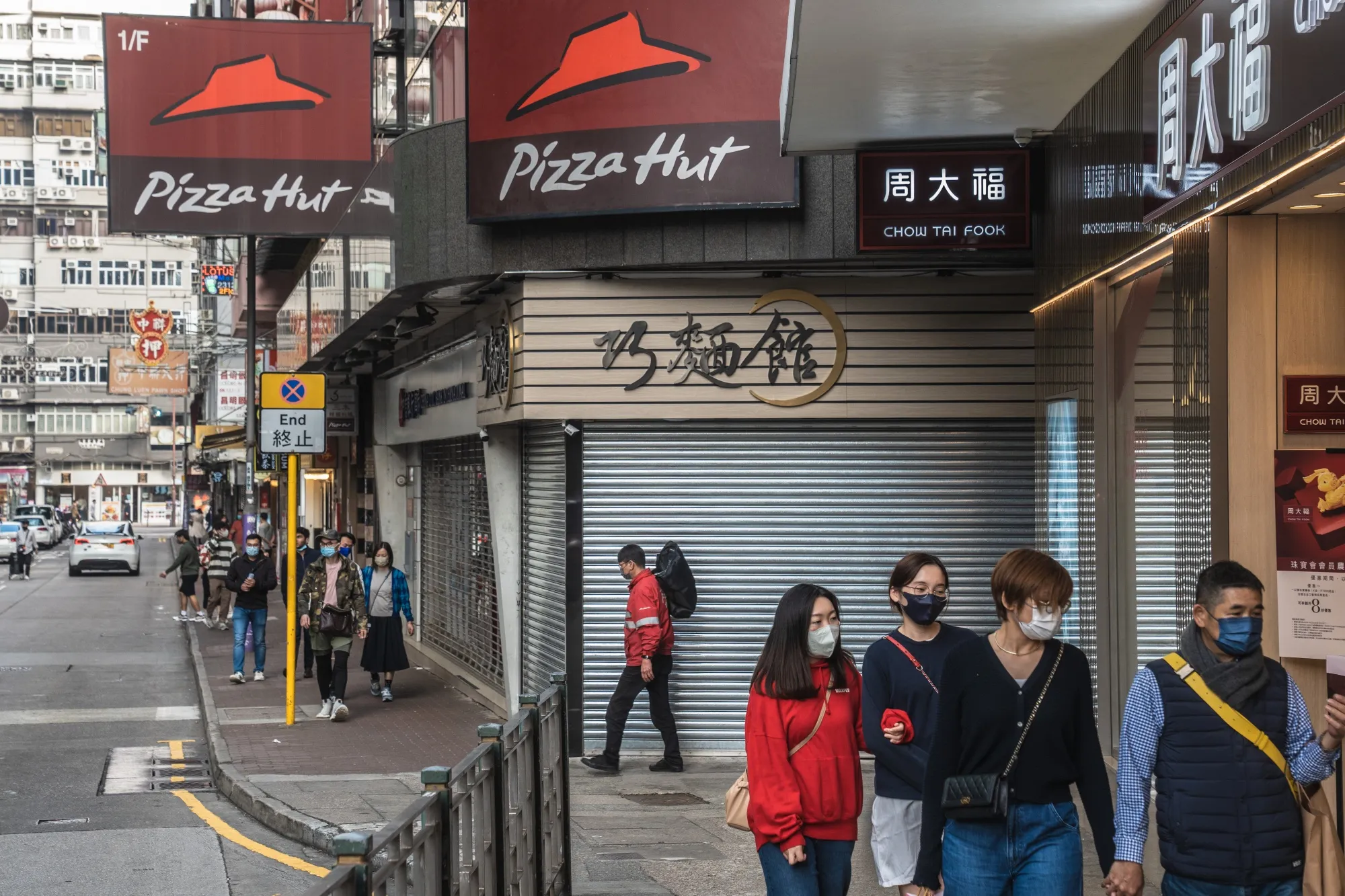 Pedestrians in the Tsim Sha Tsui district of Hong Kong, China, on Jan. 23, 2023.