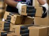 An employee stacks items to be shipped at the Amazon.com Inc. fulfillment center in Phoenix, Arizona.