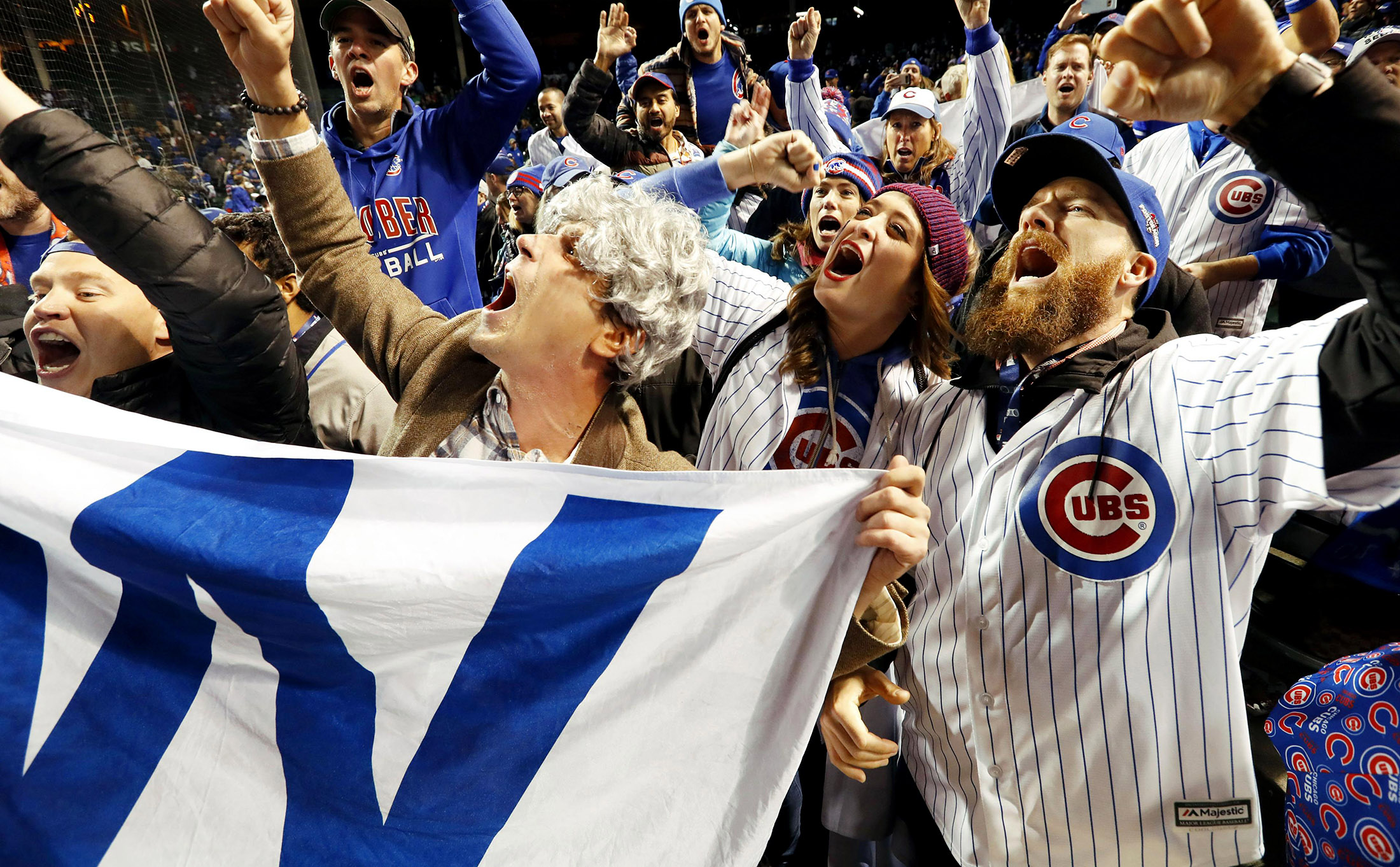 Cubs fans celebrate the team's World Series Game 5 victory at Wrigley Field in Chicago on Sunday.
