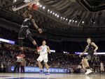 South Carolina's Chris Silva dunks against Duke's Frank Jackson in a second-round game of the NCAA men's college basketball tournament in Greenville, South Carolina, on March 19, 2017.
