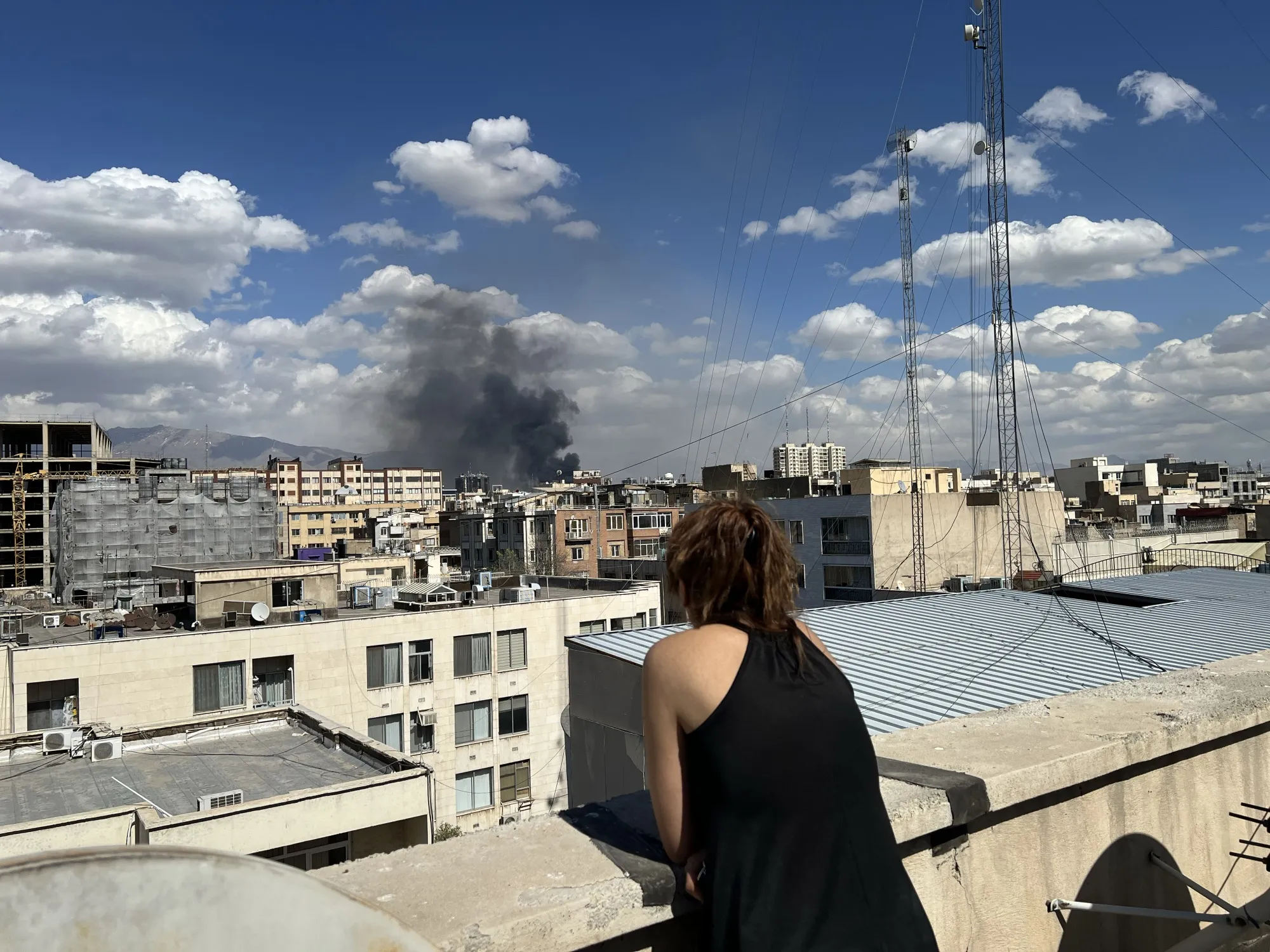 Plumes of smoke rise over the skyline following explosions in Tehran on March 1.