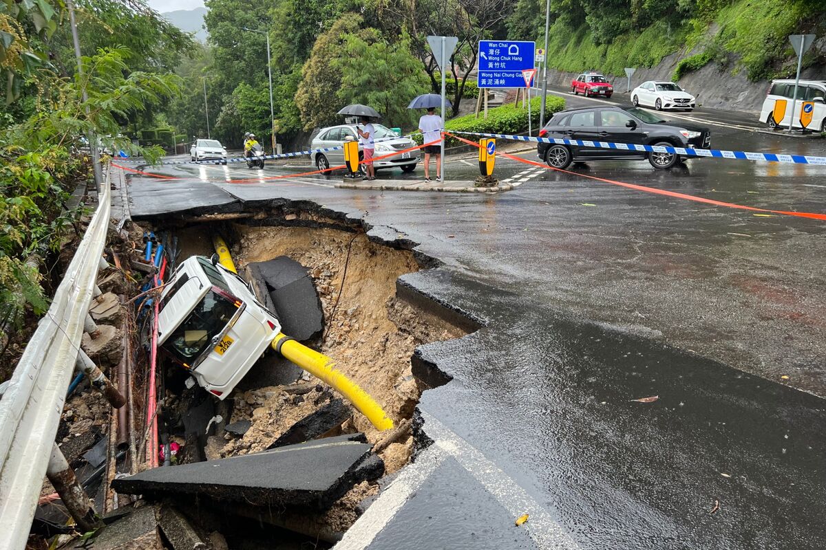 Hours of unexpected torrential rain sent Hong Kong into meltdown Friday, wi...