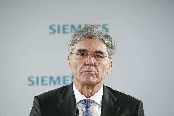 Siemens CEO Faces Down Protesters, Signals Tough Year Ahead