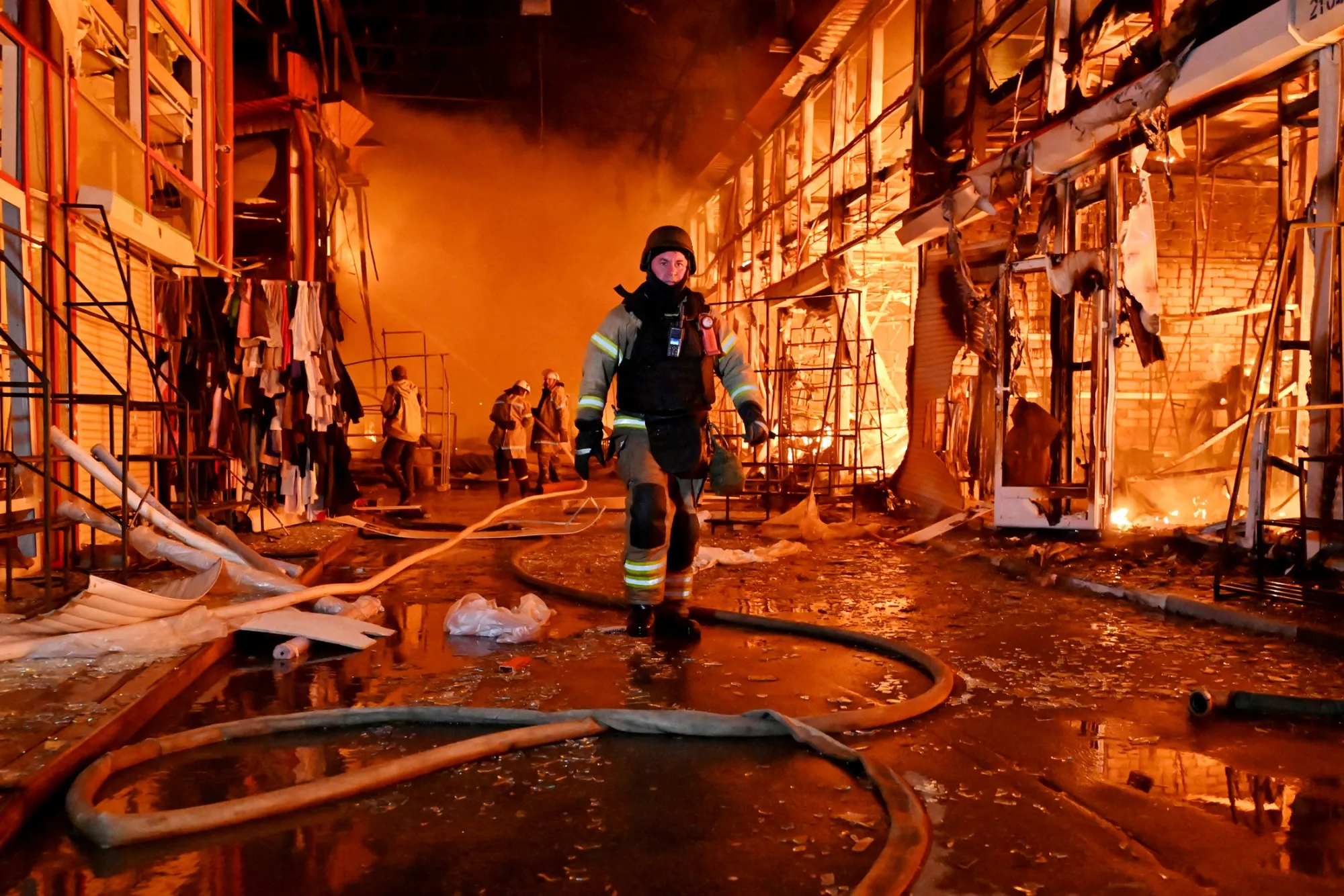 Firefighters tackle a blaze following a Russian attack on a market in Kharkiv, in October.