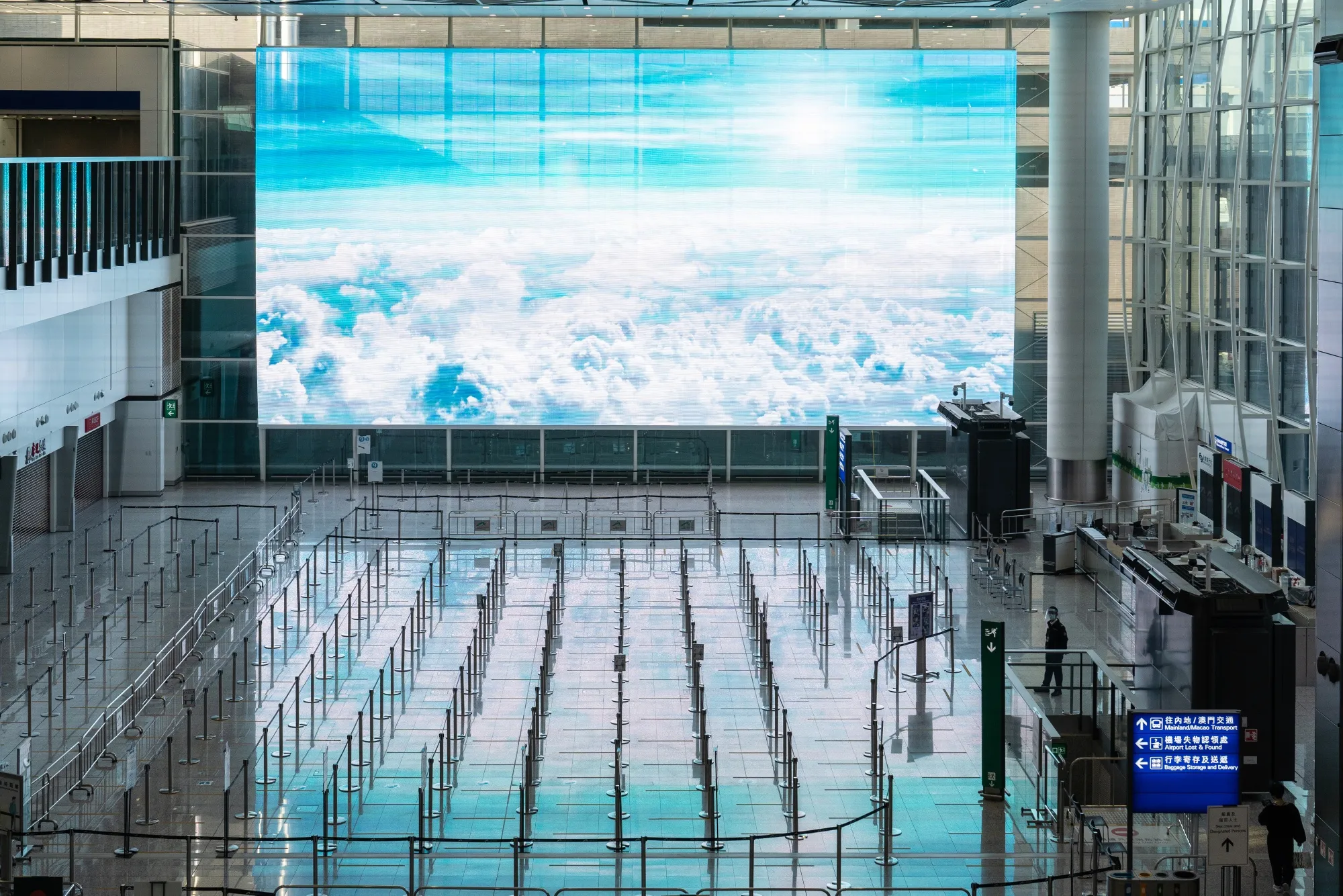 Hong Kong’s empty international airport is&nbsp;symbol of&nbsp;Covid-era hardship that’s choking the supply of talent.