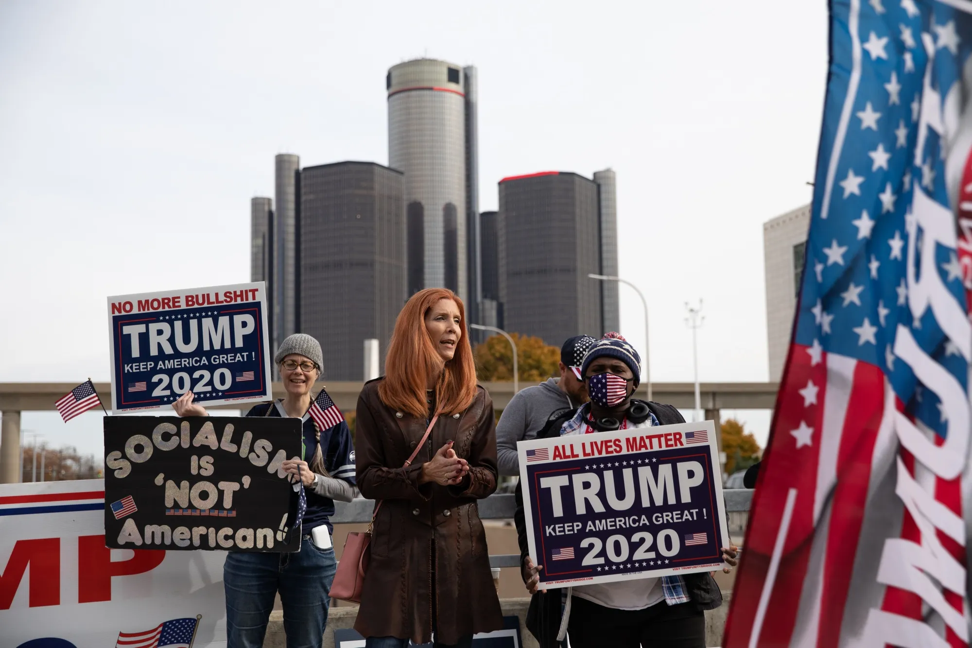 Trump supporters hold signs at a protest during the 2020 Presidential election in Detroit, Michigan.