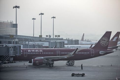 Airplanes ready to fly at Shanghai's Hongqiao Airport. With passenger numbers in China increasing 11 percent last year, carriers are scheduling more flights to handle demand.