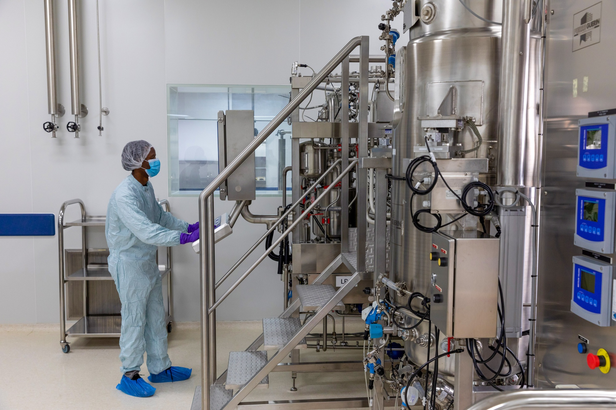A technician checks fermentation equipment in a laboratory on a non-production day at the Biovac Institute facility, part of the World Health Organization’s mRNA technology transfer hub in Cape Town, South Africa, on Monday, Sept. 12, 2022. The WHO set up the hub, its first, in June last year to address concerns poor countries weren’t getting sufficient access to life-saving Covid shots as the bulk of them went to affluent countries. Photographer: Dwayne Senior/Bloomberg