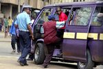 A Kenyan policeman boards a matatu after the vehicle was stopped for a traffic offense. “Every matatu driver has been in jail at least once,” says James Kariuki, a 20-year veteran of the industry.