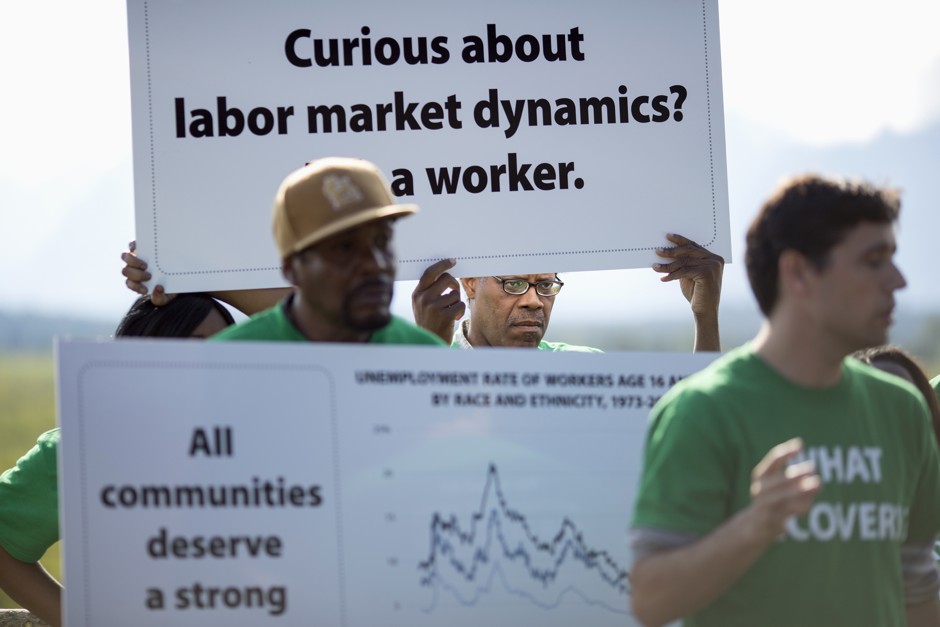 Derek Laney of St. Louis protests during the Jackson Hole Economic Policy Symposium in Jackson Hole, Wyoming August 21, 2014. Laney joined workers from a coalition of organizations and travelled to Jackson, Wyoming to tell his story of income inequality and unemployment.