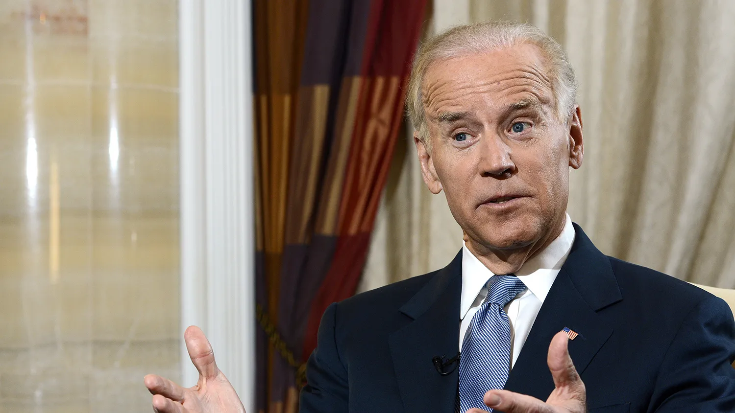 U.S. Vice President Joseph "Joe" Biden gestures as he speaks during an interview in Singapore, on Saturday, July 27, 2013.

