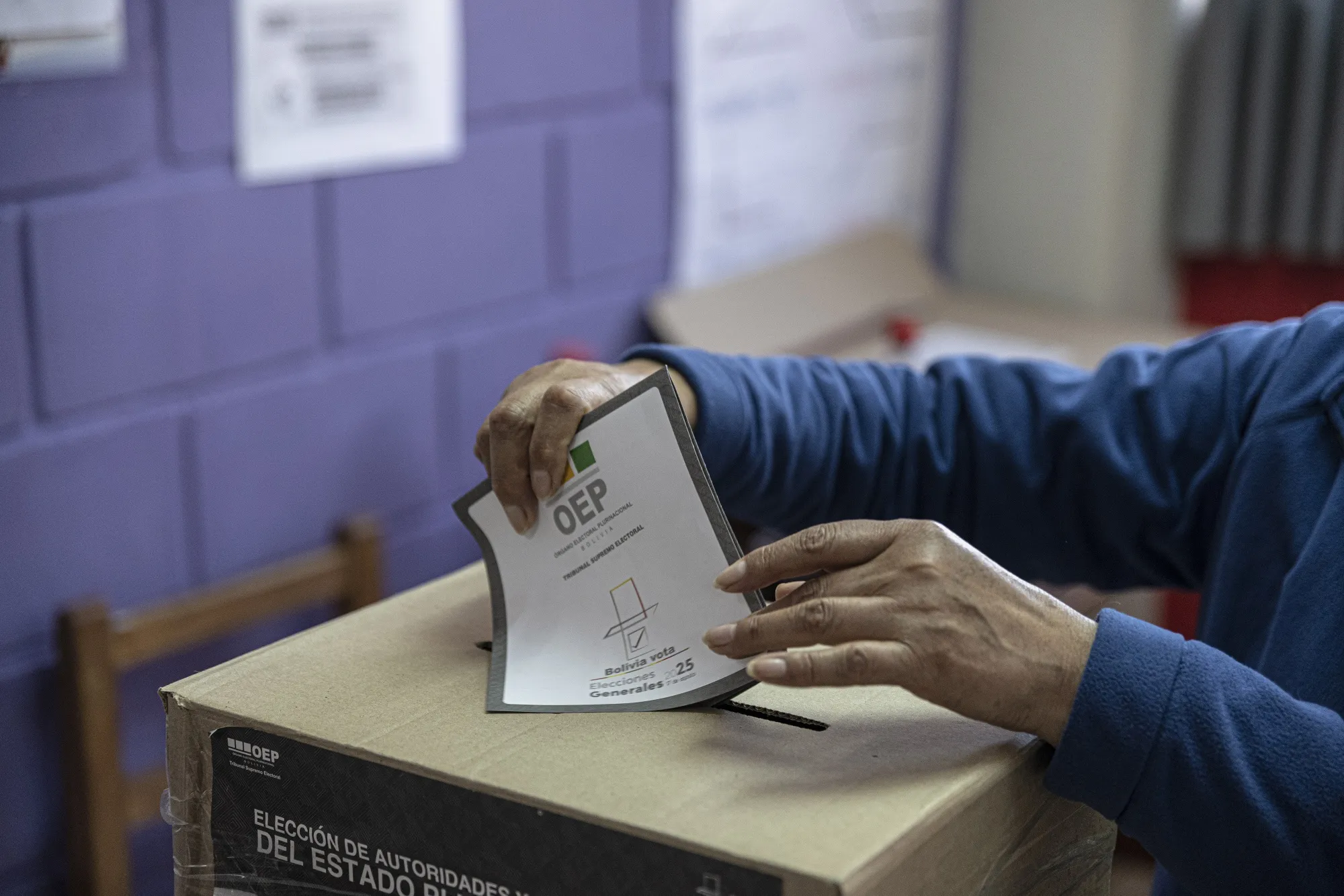 A voter casts their ballot at a polling station during the presidential election in La Paz, Bolivia, on&nbsp;Aug. 17.