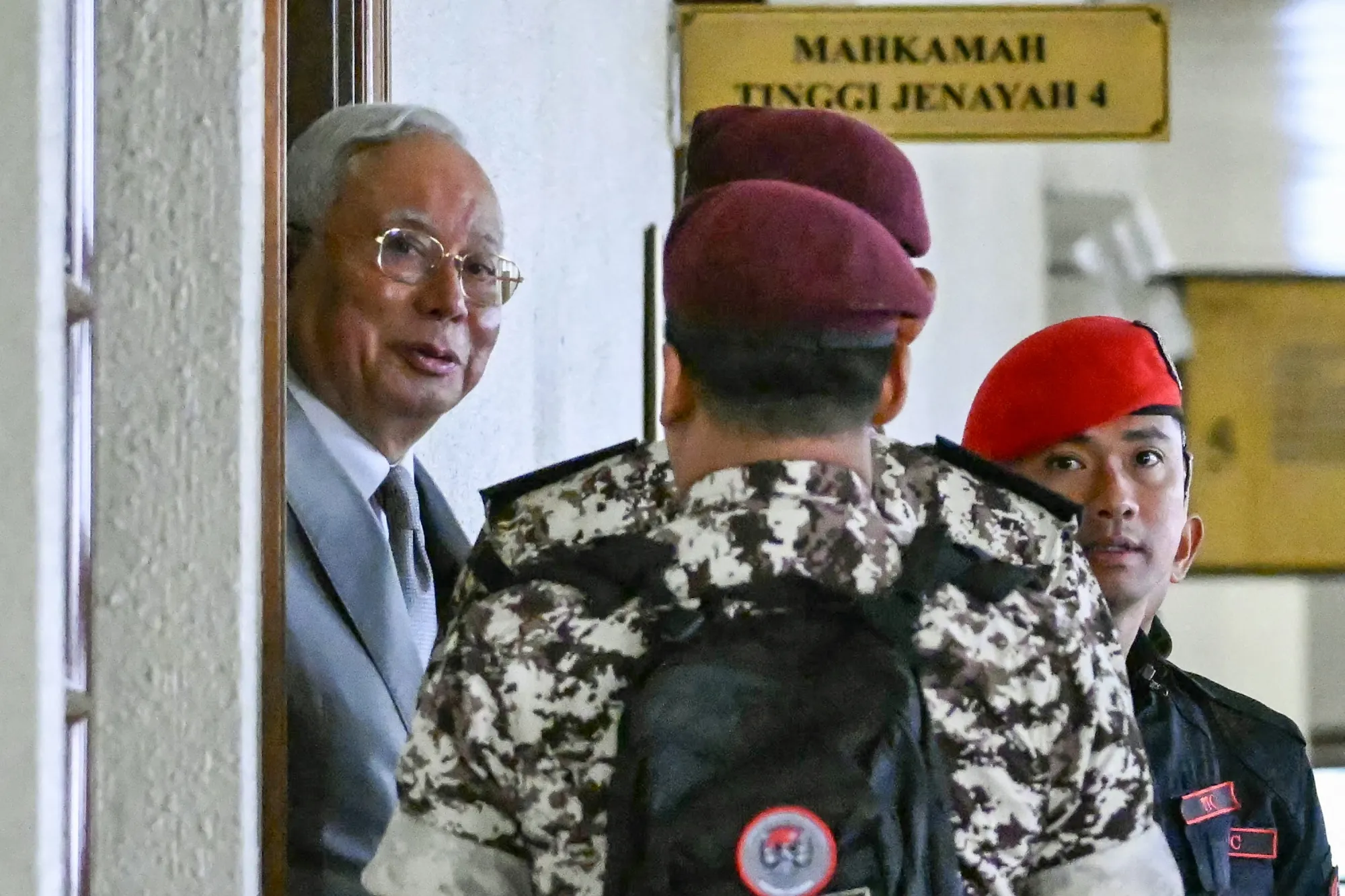 Former Malaysian Prime Minister&nbsp;Najib Razak, left,&nbsp;arrives for a court hearing at the Kuala Lumpur High Court&nbsp;on Dec.&nbsp;22.