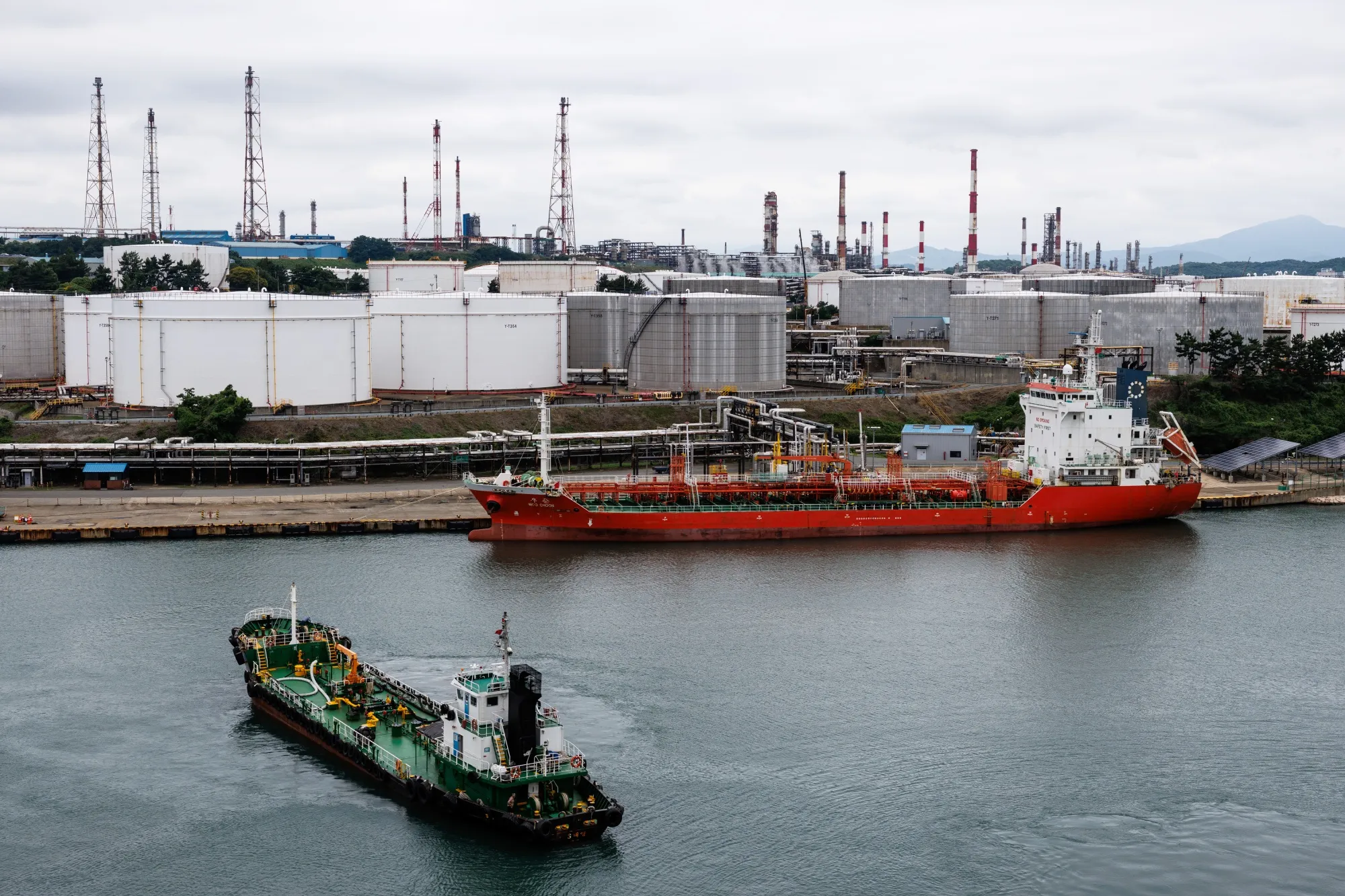 An oil tanker docked at the SK Innovation Co. Ulsan Complex oil refinery facilities in Ulsan, South Korea.