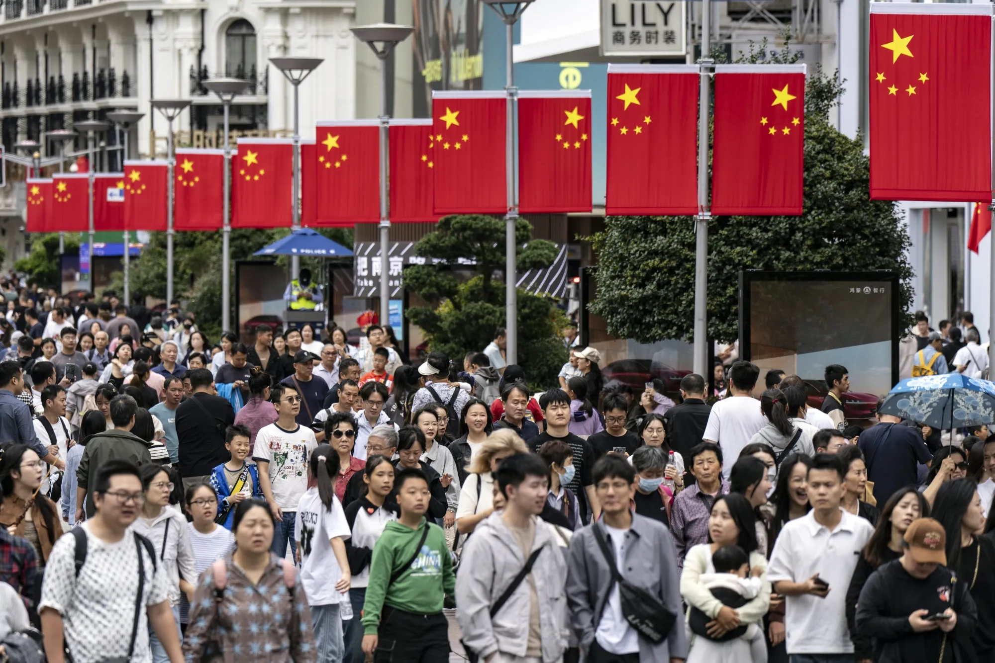 Shoppers on Nanjing East Road in Shanghai.