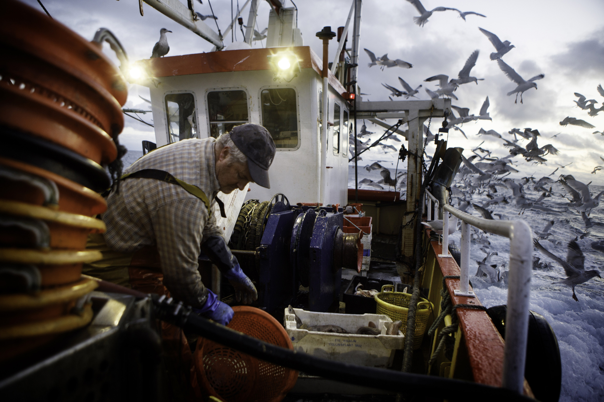 A skipper works aboard his fishing trawler&nbsp;offshore from Newlyn, U.K.