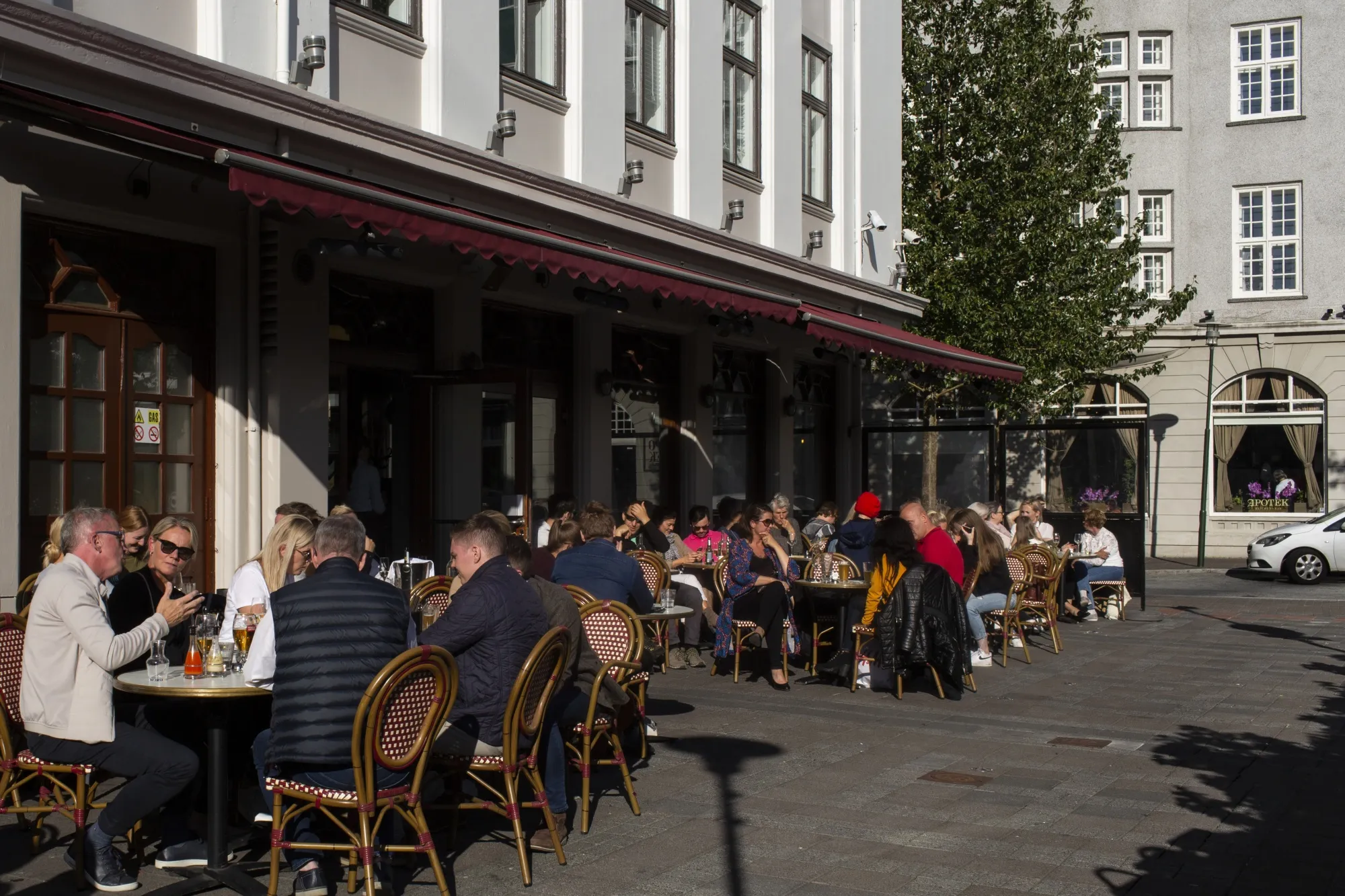 Customers at terraced tables outside restaurants&nbsp;in Reykjavik, Iceland, on July 19.