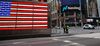 New York Police Department (NYPD) officers stand neat the Nasdaq MarketSite in Times Square in New York, U.S., on Tuesday, April 21, 2020.morning.