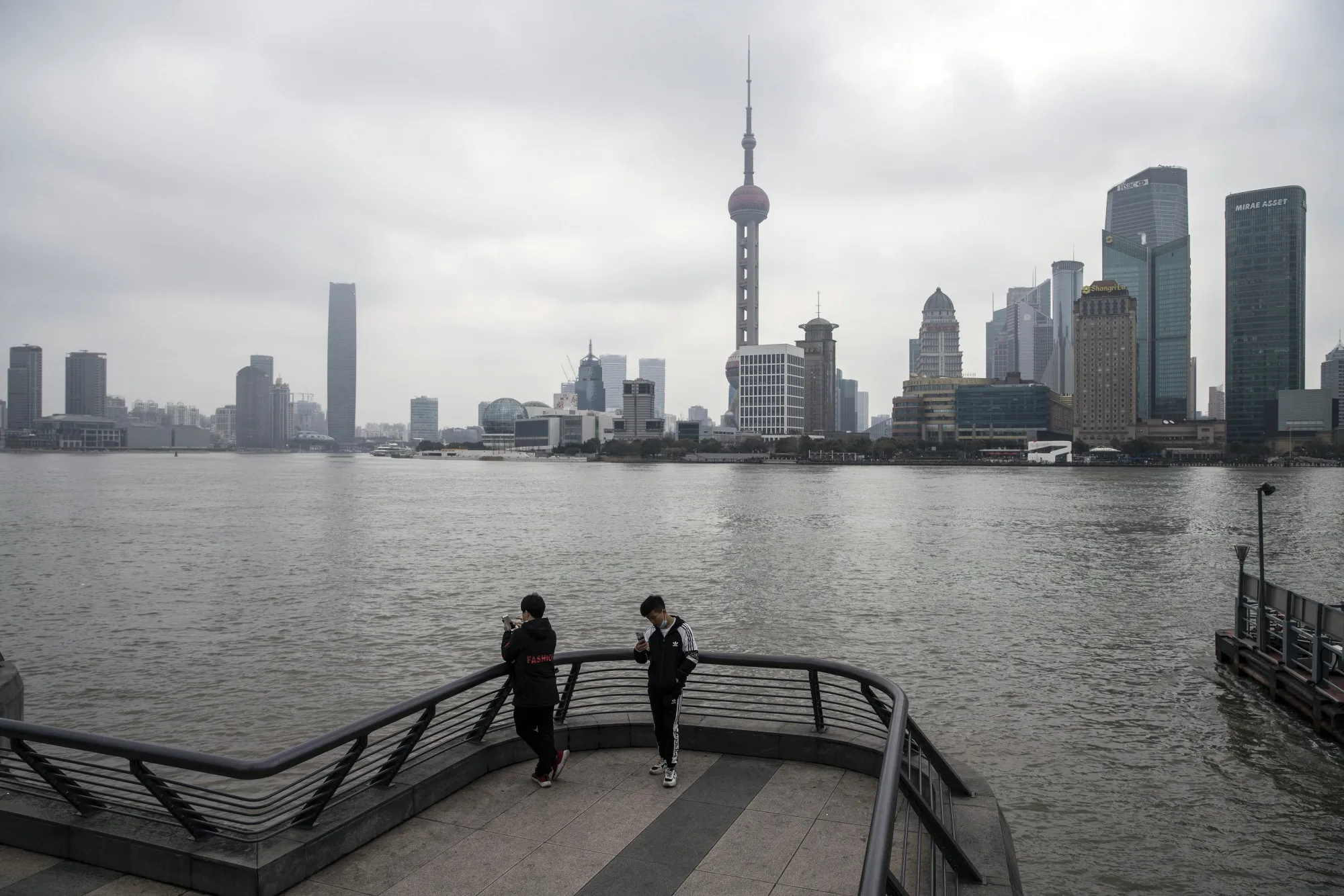 Shanghai on Feb. 12.&nbsp;UBS and Credit Suisse both have aggressive plans to expand on the mainland.&nbsp;