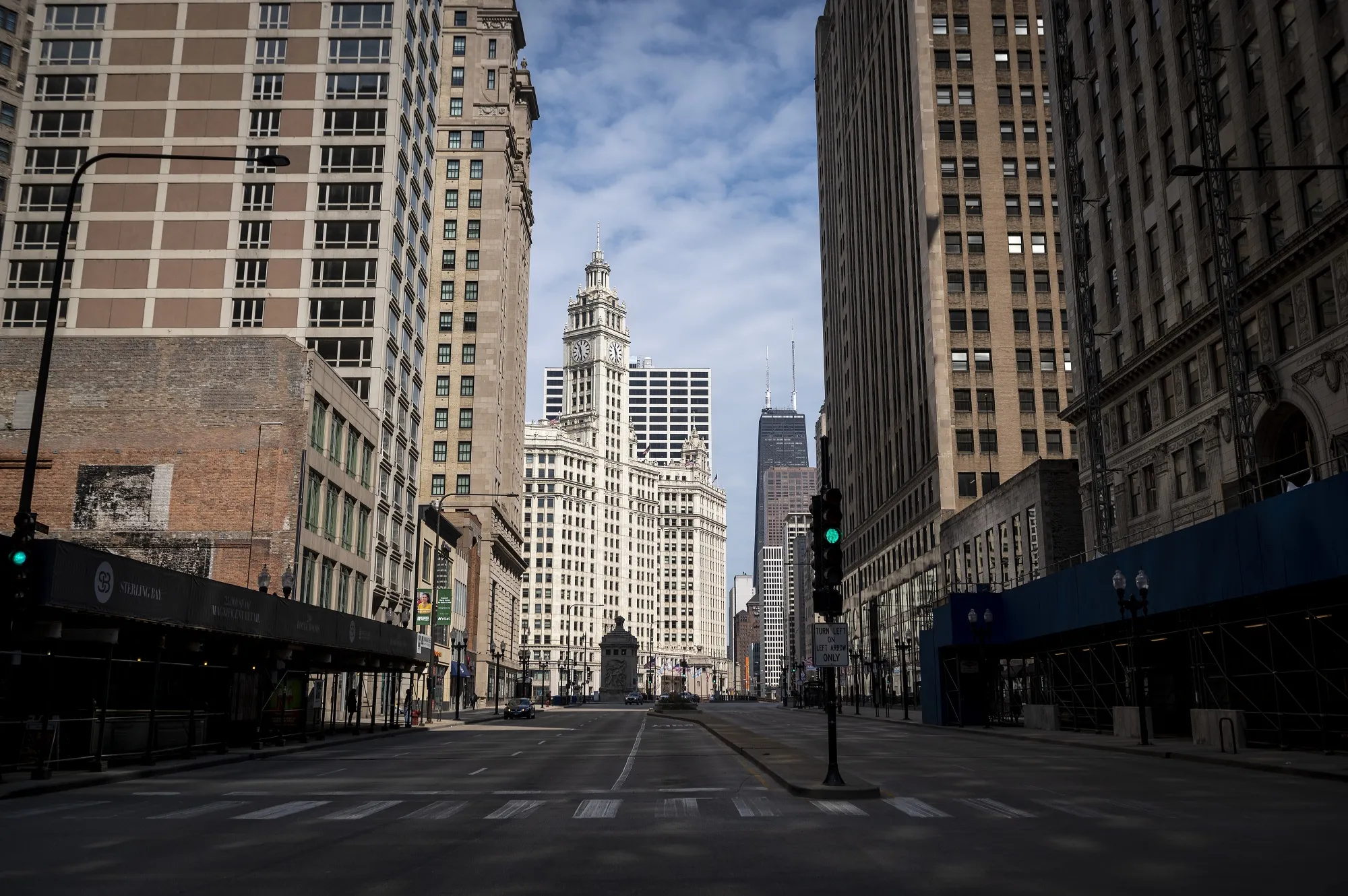 The Wrigley Building stands at the end of a near-empty street in Chicago on April 3.