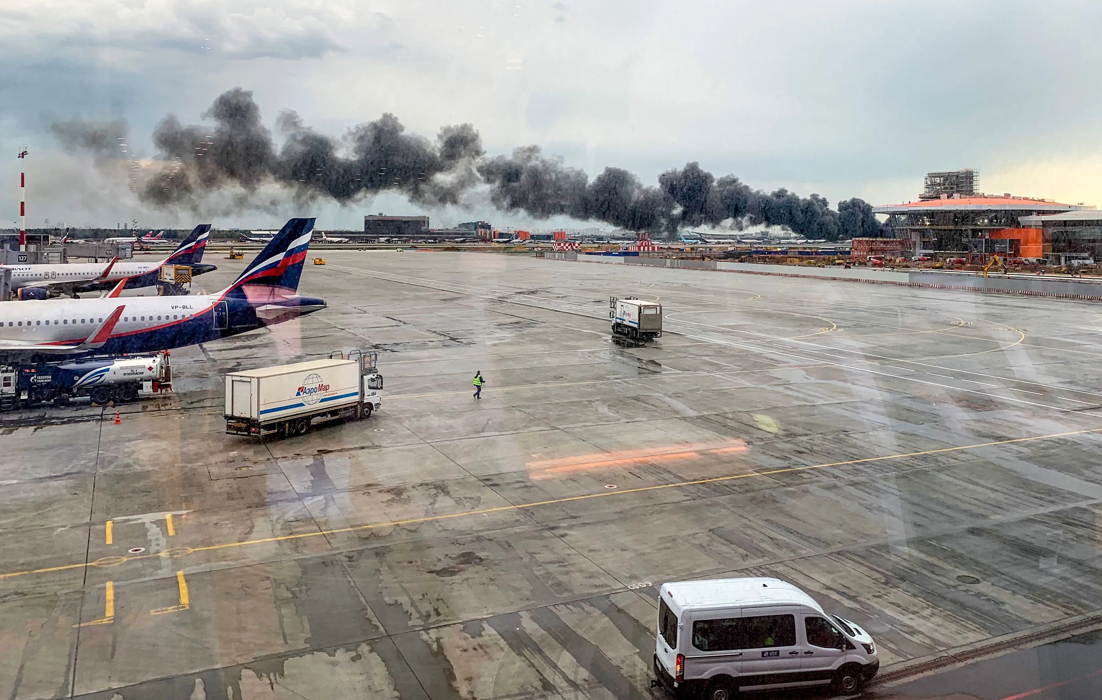 Smoke billows from Aeroflot Flight 1492 at Sheremetyevo airport on May 5.