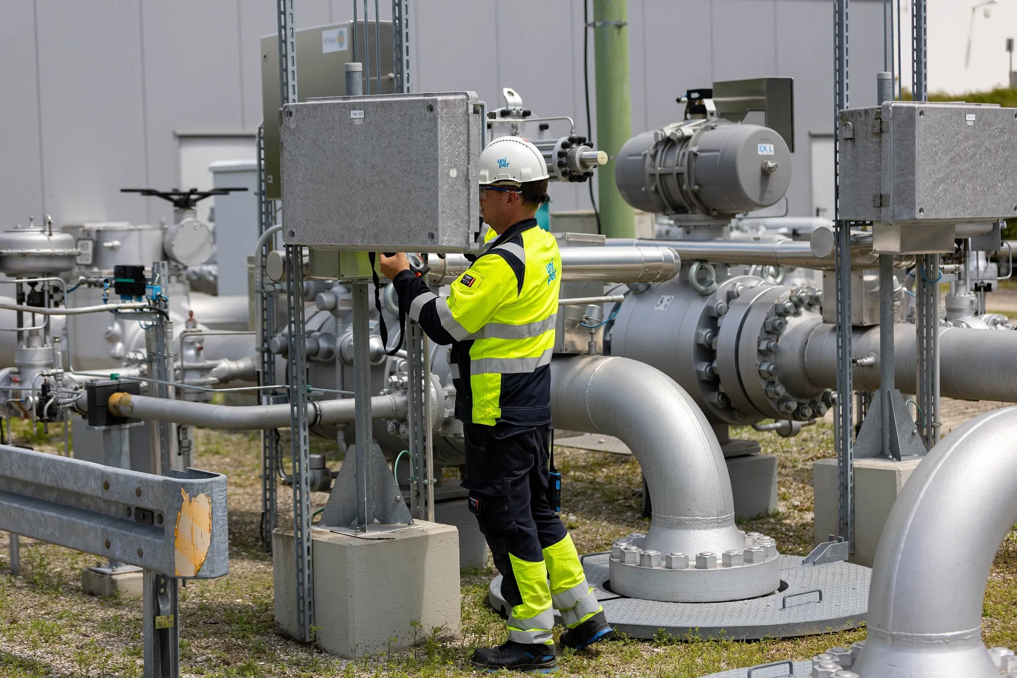 An employee monitors for gas leaks during safety checks at a natural gas storage facility, in Muhldorf, Germany.