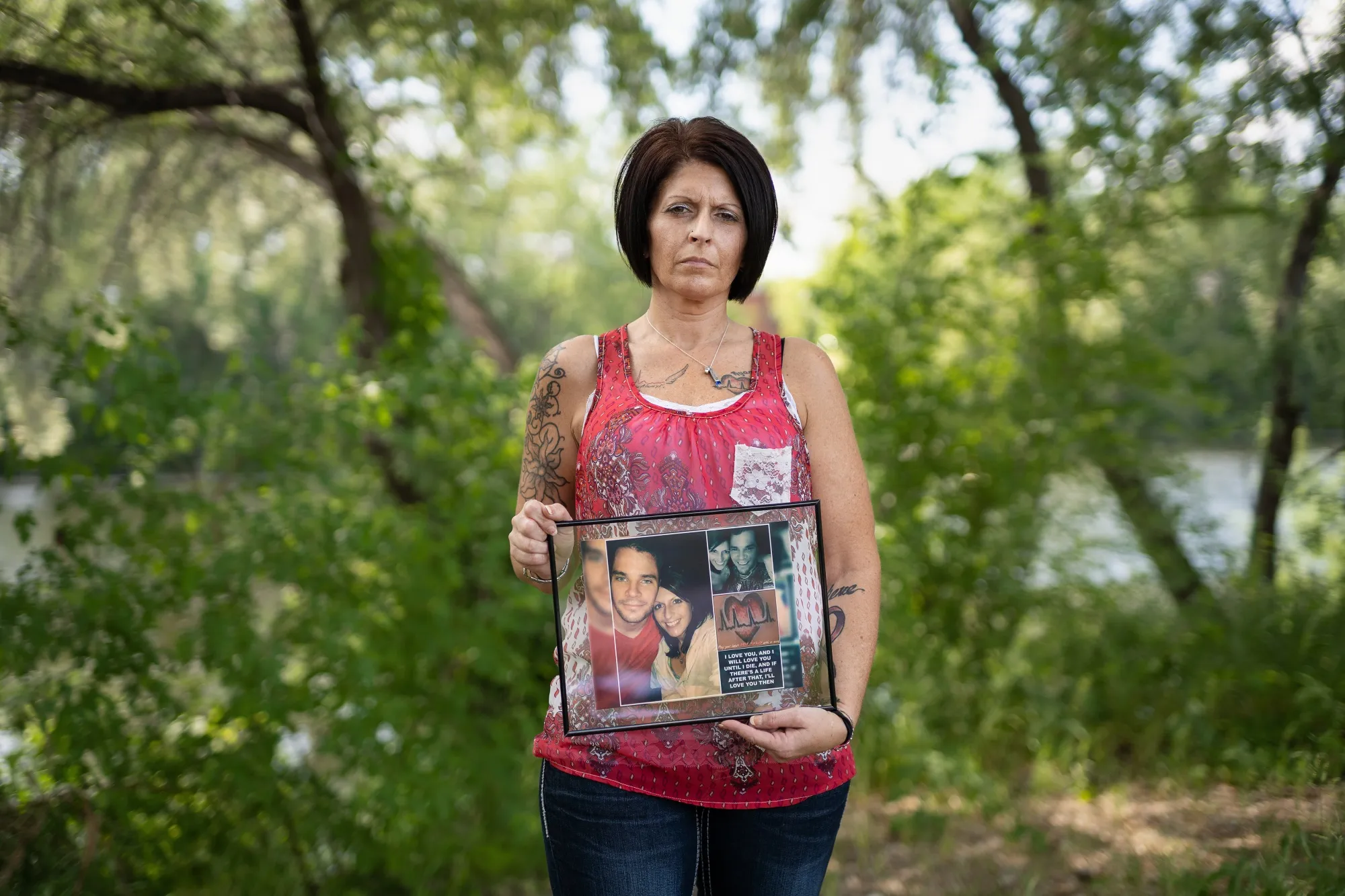 Anne Emerson holds photographs of her and her late fiancé, Ryan, in Coon Rapids, Minnesota.