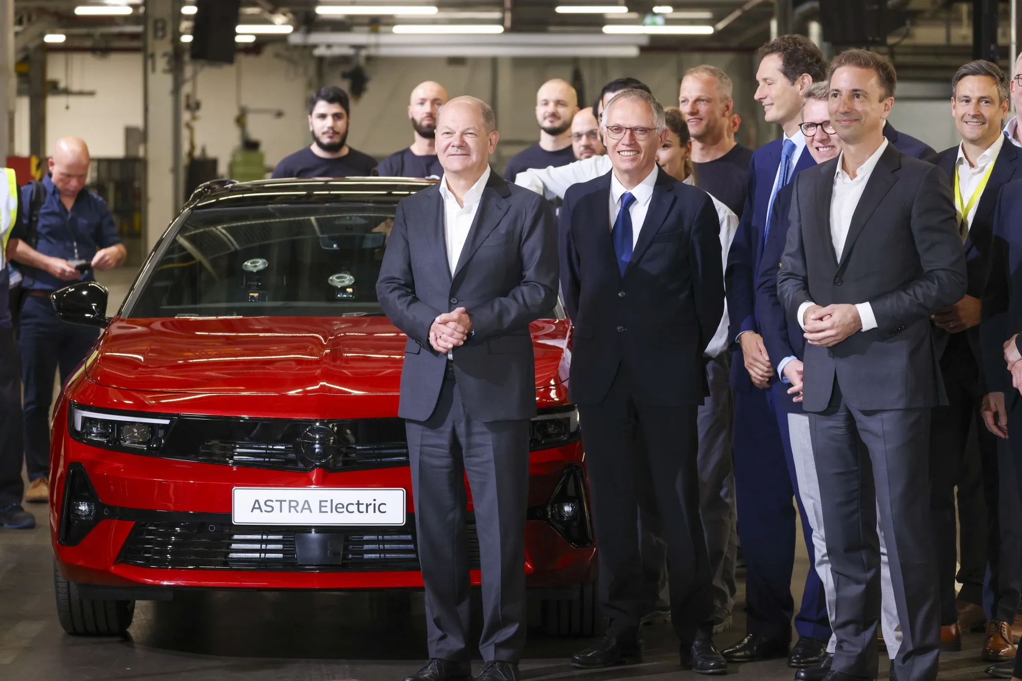 Olaf Scholz, with Carlos Tavares, and Florian Huettl, at the Opel Russelsheim Plant in Russelsheim, Germany, on June 8.