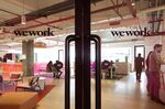Signage is displayed on glass doors at the WeWork Cos. 32nd Milestone co-working space in Gurugram, India, on Monday, Feb. 18, 2019.
