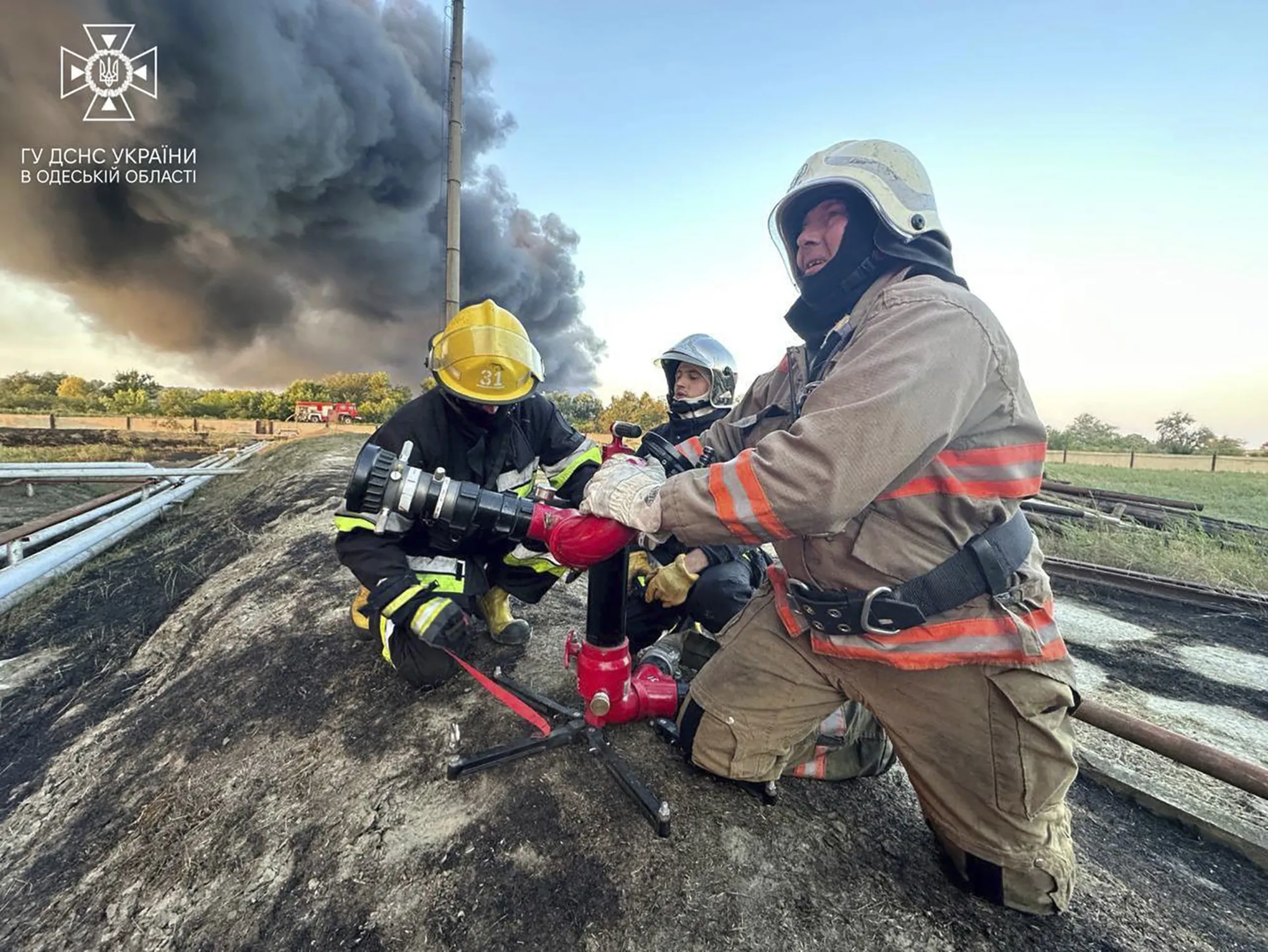 Rescuers work to extinguish a fire following a Russian attack in the Odesa region on Sept. 6.