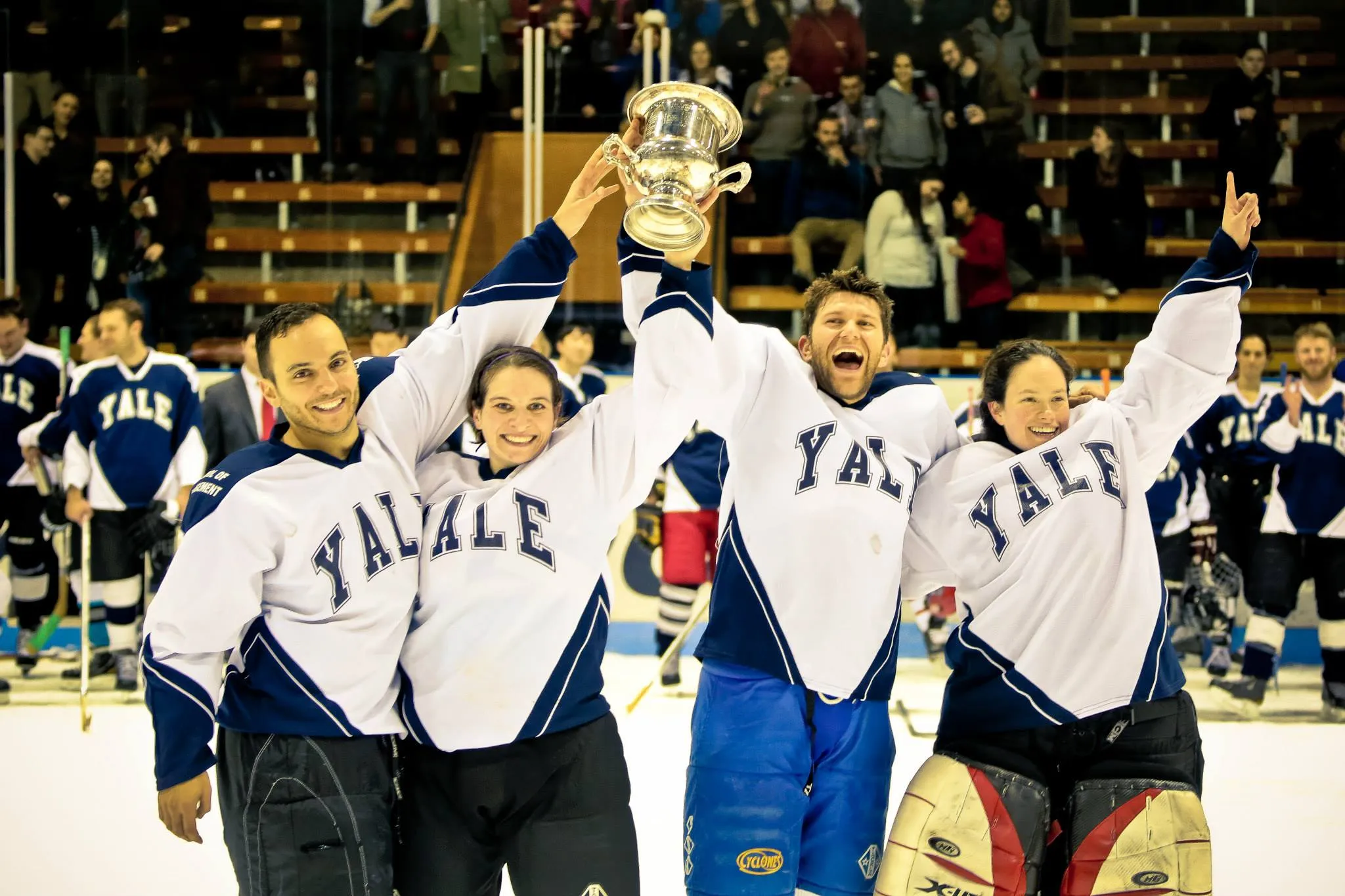 The four captains from Yale School of Management's class of 2014, celebrating their win of a tournament where first-year students play second-years.
