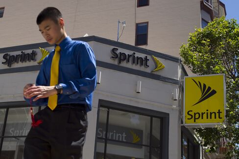 A Pedestrian Walks Past a Sprint Nextel store in San Francisco