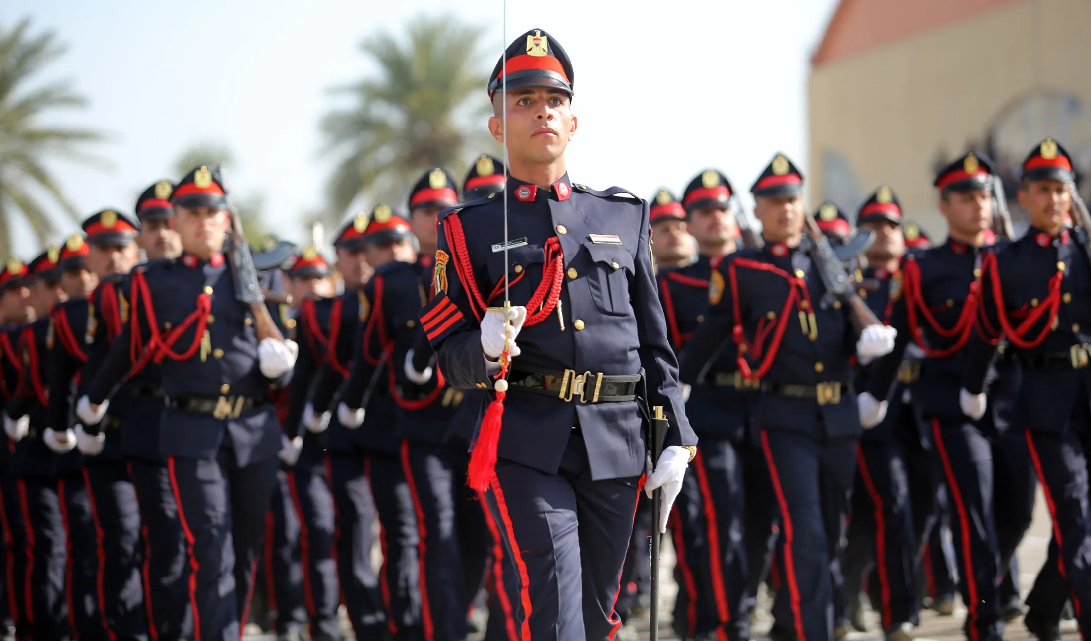 Iraqi soldiers march during the Iraq's armed forces' 95th anniversary celebrations at the Military School in Rustamiyah district of Baghdat, Iraq in 2016.
