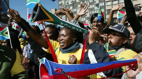 Soccer fans from Johannesburg celebrate '30 Days To The 2010 FIFA World Cup' at the Ghandi Squareon May 11, 2010 in Johannesburg, South Africa. South Africa will host football's biggest tournament which kicks off on June 11, 2010.
