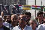 Demonstrators hold up signs depicting the image of Mahsa Amini, who died while in the custody of Iranian authorities, during a protest denouncing her death in Arbil, the capital of Iraq’s autonomous Kurdistan region, on Sept. 24.