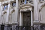 A pedestrian wearing a protective mask walks past the Central Bank of Argentina in&nbsp;Buenos Aires, Argentina, on&nbsp;April 30.