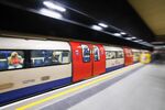 An underground train passes through the Battersea Power Station on the London Underground network in London, U.K.