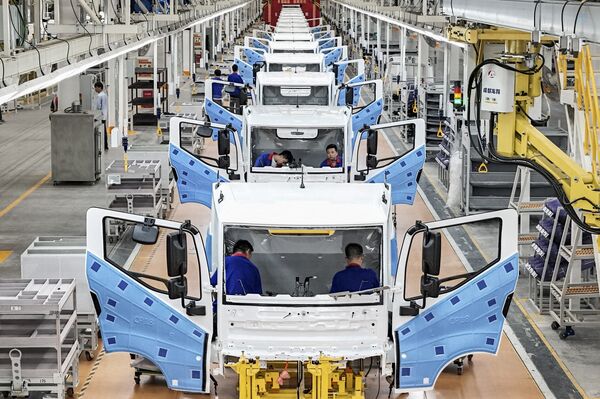 Employees work on the assembly line at a BYD factory in Huai'an, China.