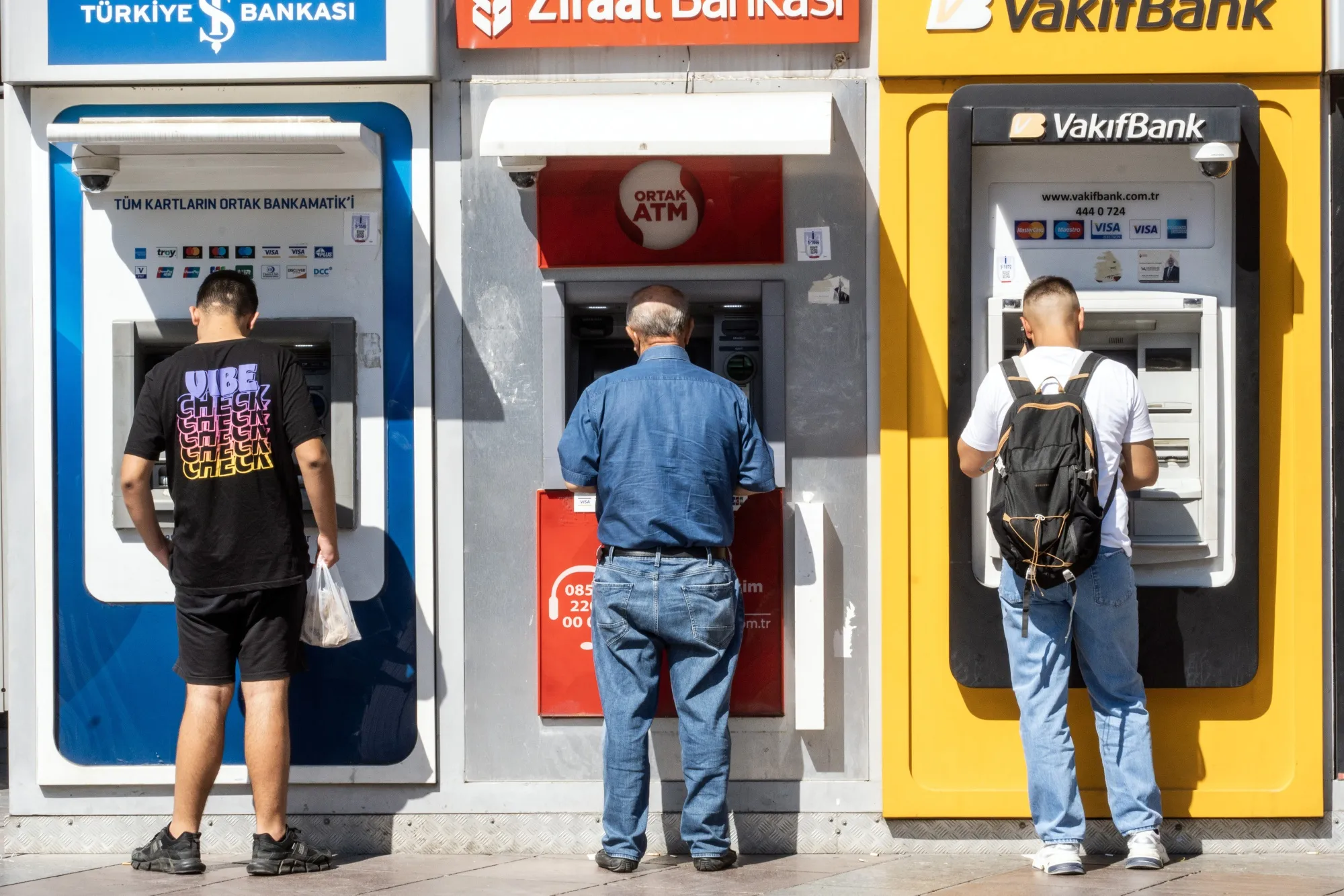 Customers use automated teller machines&nbsp;in Ankara, Turkey. The Turkish lira has lost 28% of its value against the dollar so far this year, one of the worst performances in emerging markets.&nbsp;